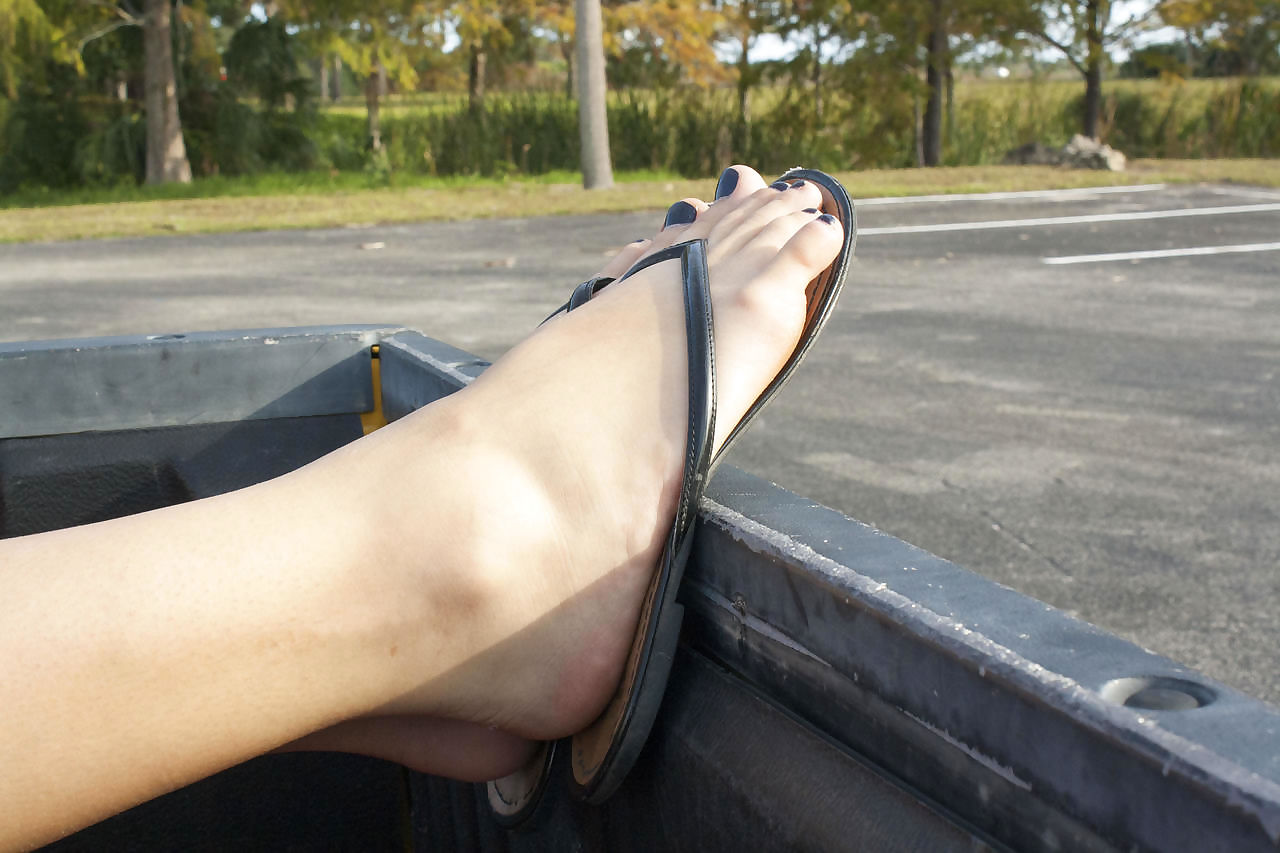 Blonde amateur Annabel Harvey shows her feet and pussy in back of pickup truck