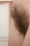 Skinny girl Lisa Carry undresses to show tiny tits and spread her hairy beaver