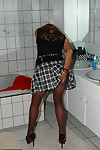 Mature redhead Kyras Nylons hikes her skirt over her pantyhose in the bathroom