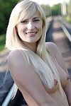 Leggy blonde Margo H strips to ankle strap heels on railway tracks