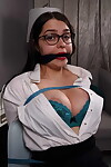 Fully clothed secretary exhibits healthy cleavage while bound and gagged
