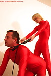 Dominant females force an older submissive male to submit during BDSM play