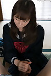 Japanese schoolgirl removes over the knee nylons before giving a footjob