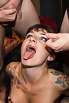 Tattooed slut Adreena takes multiple facial cumshots during a blowbang
