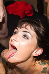 Tattooed slut Adreena takes multiple facial cumshots during a blowbang