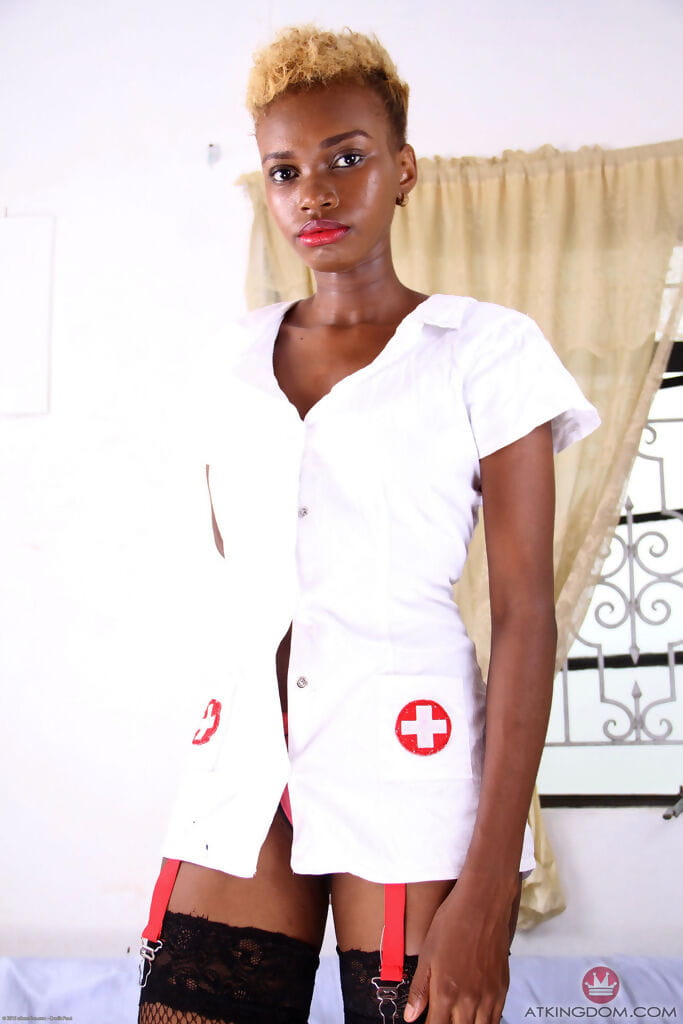 Black nurse removes her uniform to display her twat in stockings only