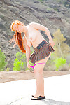 Natural redhead flashes naked upskirt in the wind and bares her huge breasts