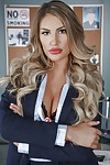 Stocking clad blonde babe August Ames revealing big pornstar tits in office