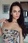 Slender brunette teen Debora A unzips short dress to show her yummy pussy